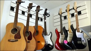 Photo of acoustic and electric guitars for sale at 5 Star Pawn.